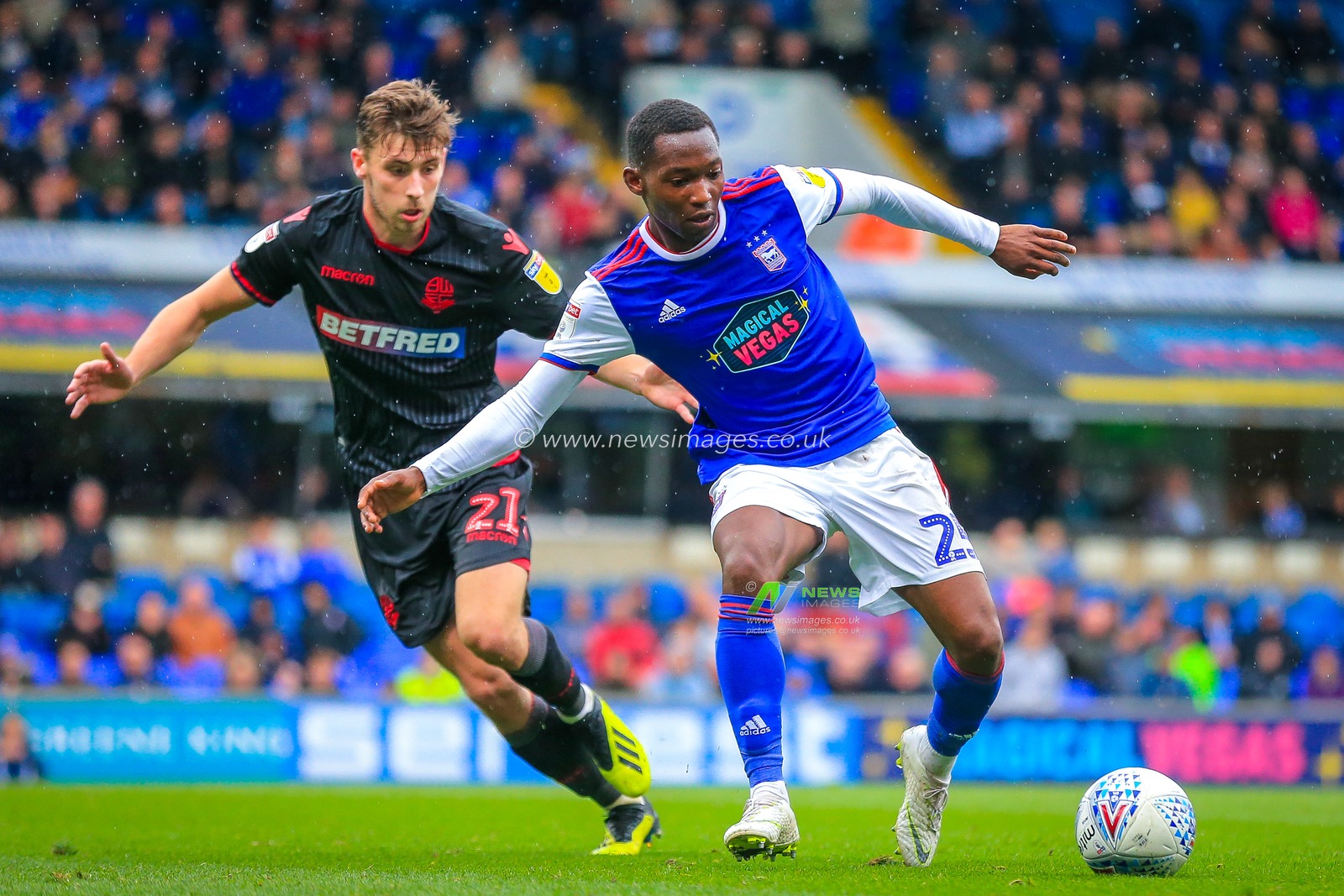 22nd September 2018, Portman Road, Ipswich, England; Sky Bet Championship Ipswich Town v Bolton Wonderers ; Tayo Edun (25) of Ipswich controls the ball under the watchful eye of Joe Williams (21) of Bolton.

Credit: Georgie Kerr/News Images

EDITORIAL USE ONLY No use with unauthorised audio, video, data, fixture lists, club/league logos or 'live' services. Online in-match use limited to 45 images, no video emulation. No use in betting, games or single club/league/player publications and all English Football League images are subject to DataCo Licence