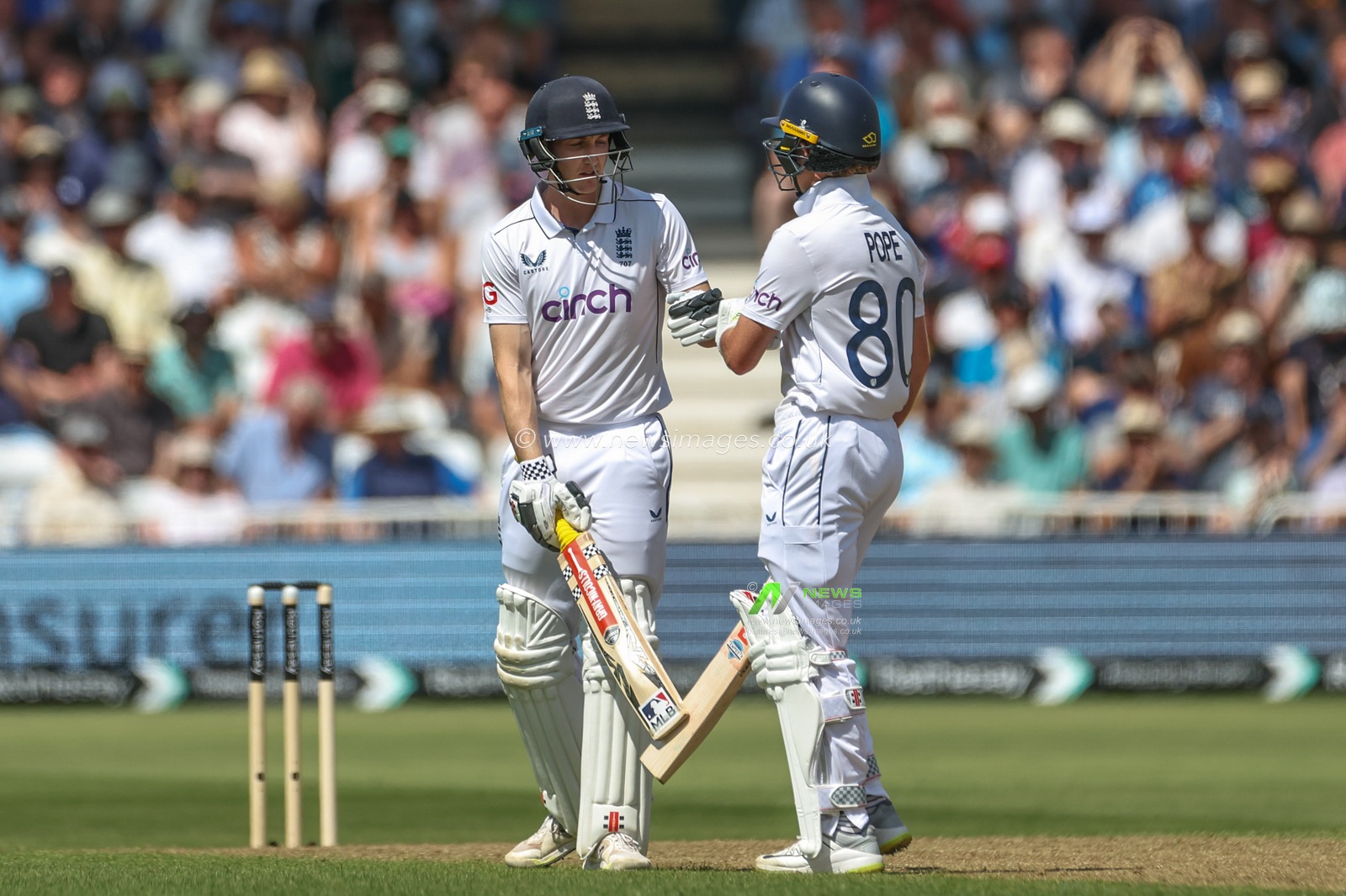 Ollie Pope of England congratulates Harry Brook of England on his third consecutive four during the 2nd Rothesay Test Match match England vs West Indies at Trent Bridge, Nottingham, United Kingdom, 18th July 2024

(Photo by Mark Cosgrove/News Images)