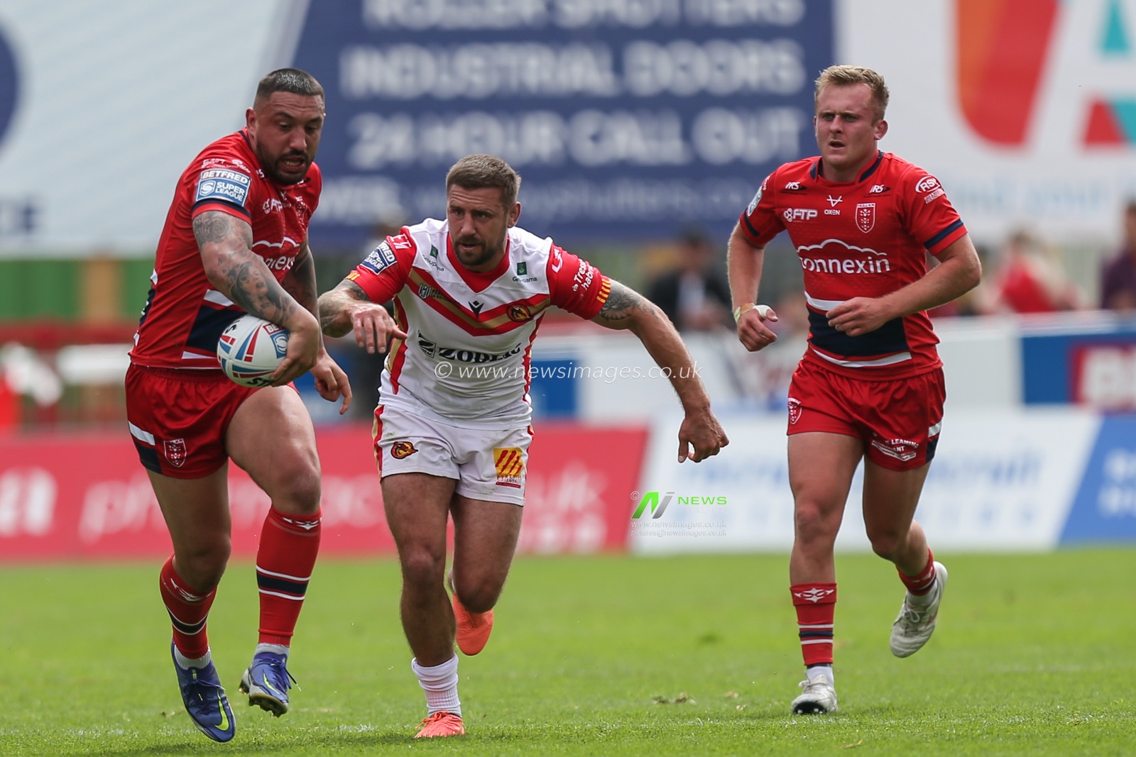 Elliot Minchella #17 of Hull KR gets away from Michael McIlorum #9 of Catalans Dragons