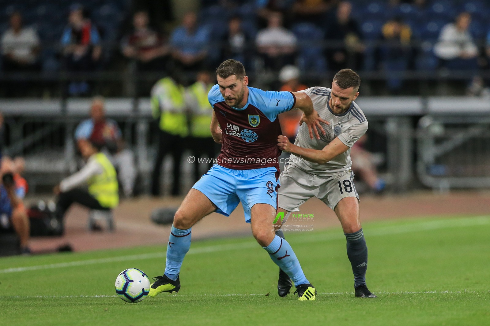 2nd August 2018, Turf Moor, Burnley, England; UAFA Europa League Qualifying Second Round Burnley v Aberdeen; Sam Vokes (9) of Burnley holds off Michael Devlin of Aberdeen