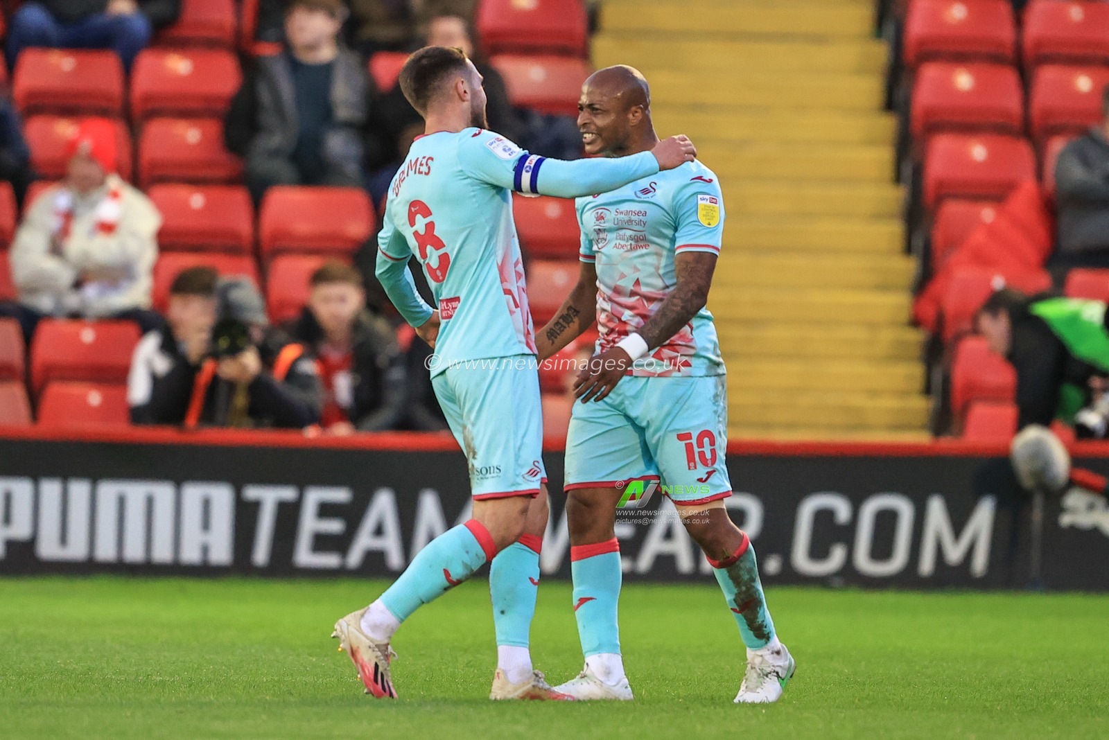 Andre Ayew #10 of Swansea City celebrates his goal to make it 0-1