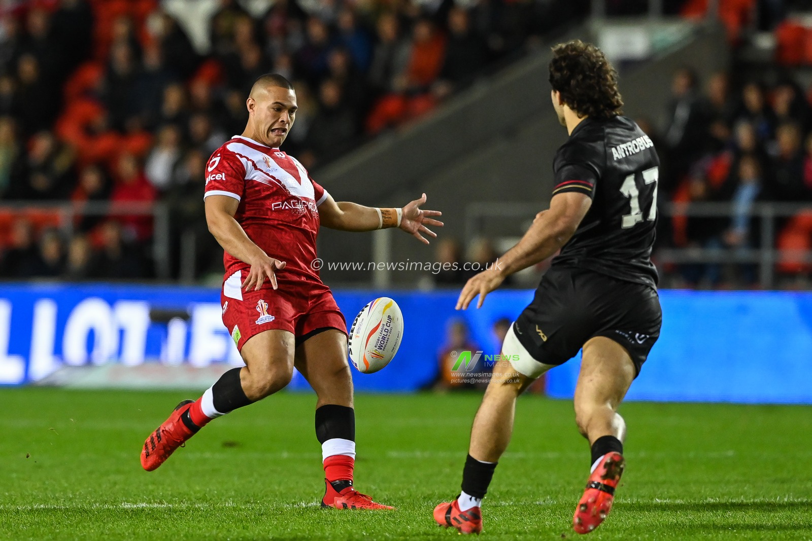 Tui Lolohea of Tonga kicks ahead during the Rugby League World Cup 2021 match Tonga vs Wales at Totally Wicked Stadium, St Helens, United Kingdom, 24th October 2022

(Photo by Craig Thomas/News Images)