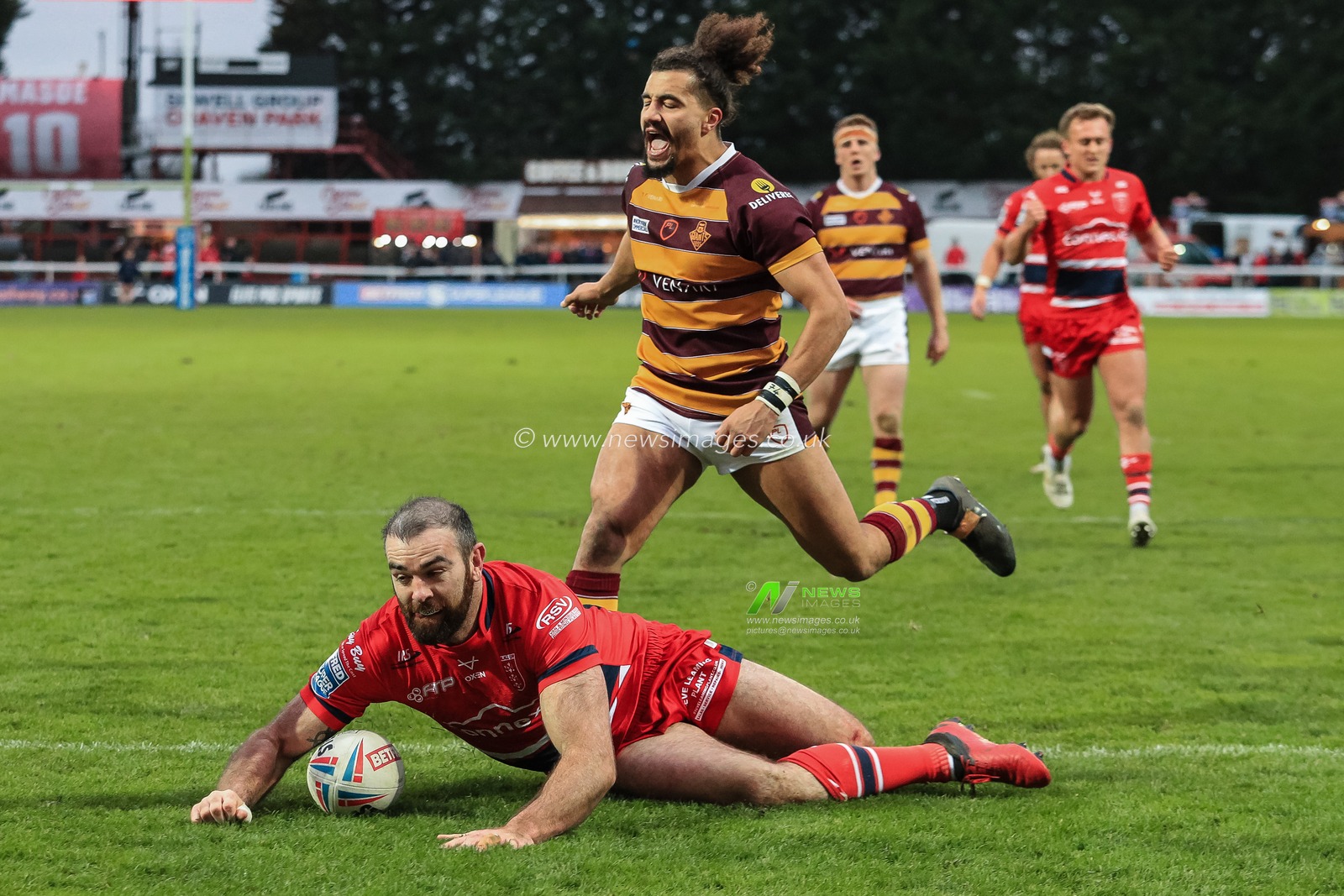Kane Linnett (12) of Hull KR goes over for a try in the second half
