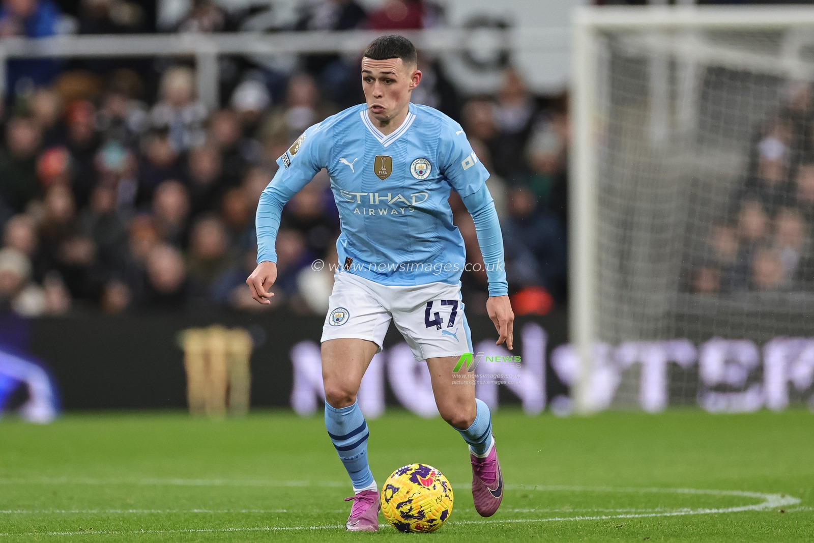 Phil Foden of Manchester City with the ball during the Premier League match Newcastle United vs Manchester City at St. James's Park, Newcastle, United Kingdom, 13th January 2024

(Photo by Mark Cosgrove/News Images)