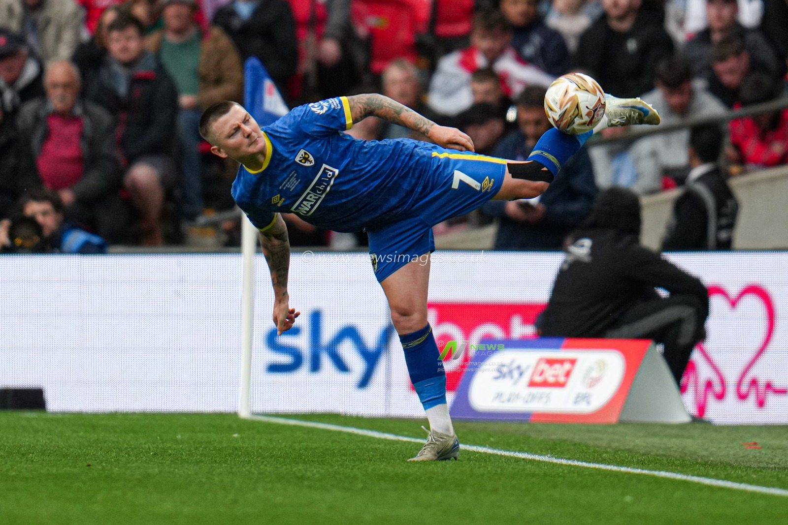 James Tilley of AFC Wimbledon touch during the Sky Bet League 2 Playoff Final match AFC Wimbledon vs Walsall at Wembley Stadium, London, United Kingdom, 26th May 2025

(Photo by Harvey Murphy/News Images)