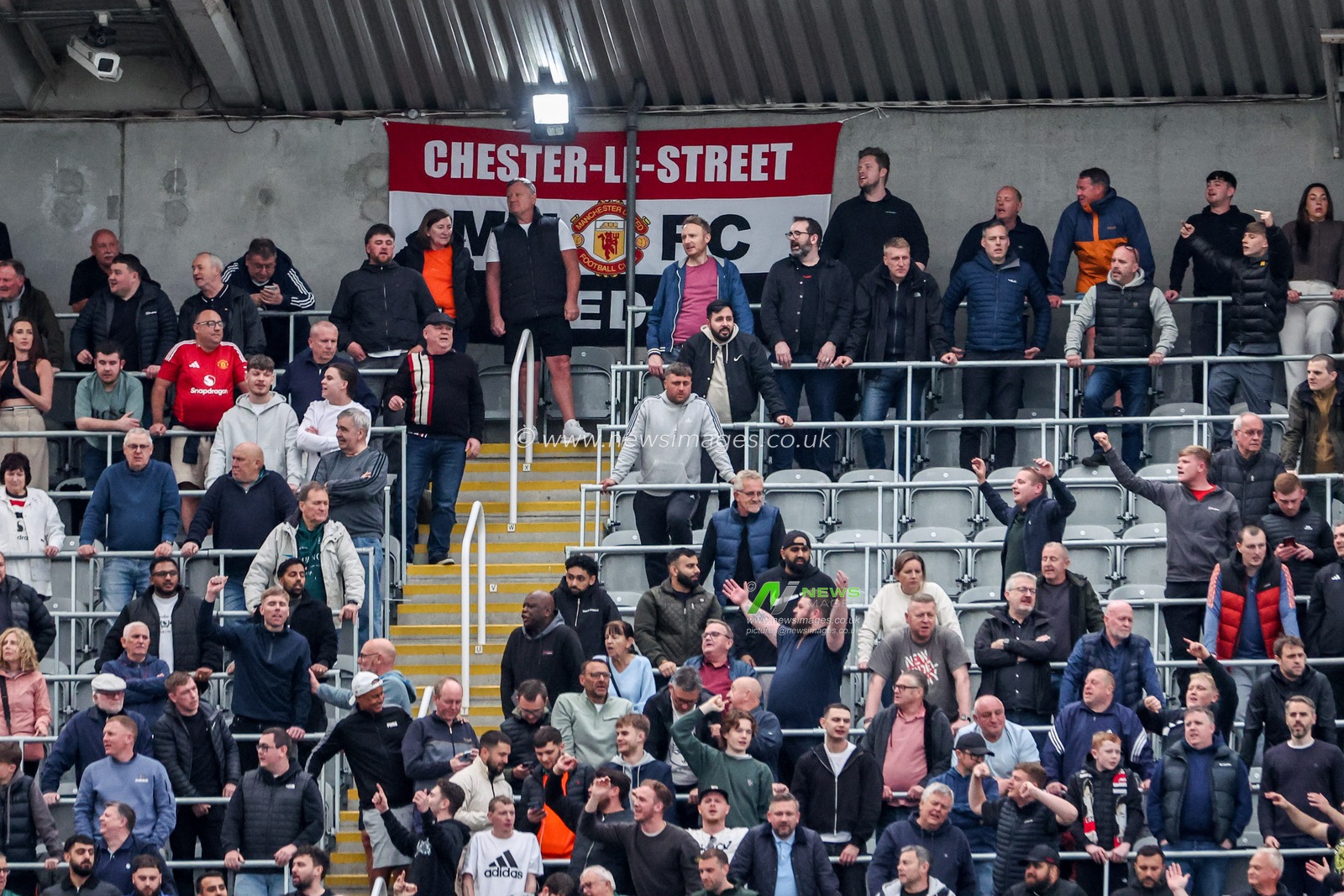 Manchester United fans celebrates the team's first goal during the Premier League match Newcastle United vs Manchester United at St. James's Park, Newcastle, United Kingdom, 13th April 2025

(Photo by Mark Cosgrove/News Images)