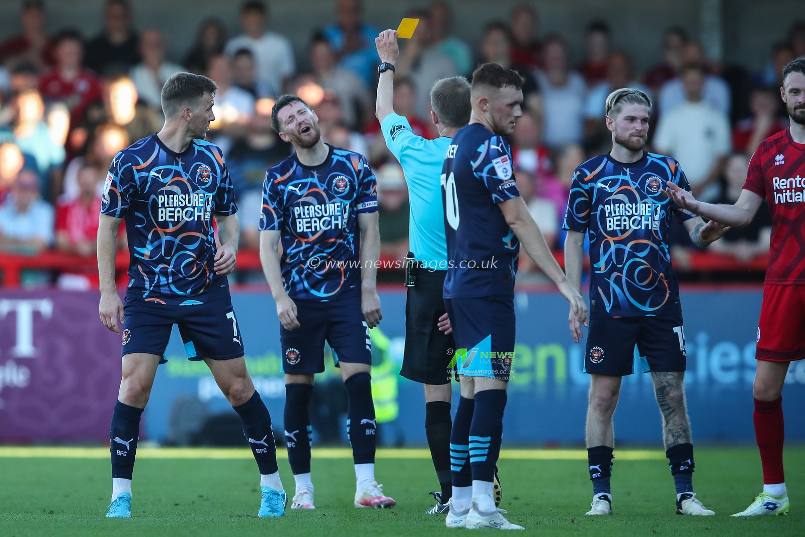 James Husband of Blackpool is shown a yellow card by referee Sam Purkiss during the Sky Bet League 1 match Crawley Town vs Blackpool at Broadfield Stadium, Crawley, United Kingdom, 10th August 2024

(Photo by Gareth Evans/News Images)
