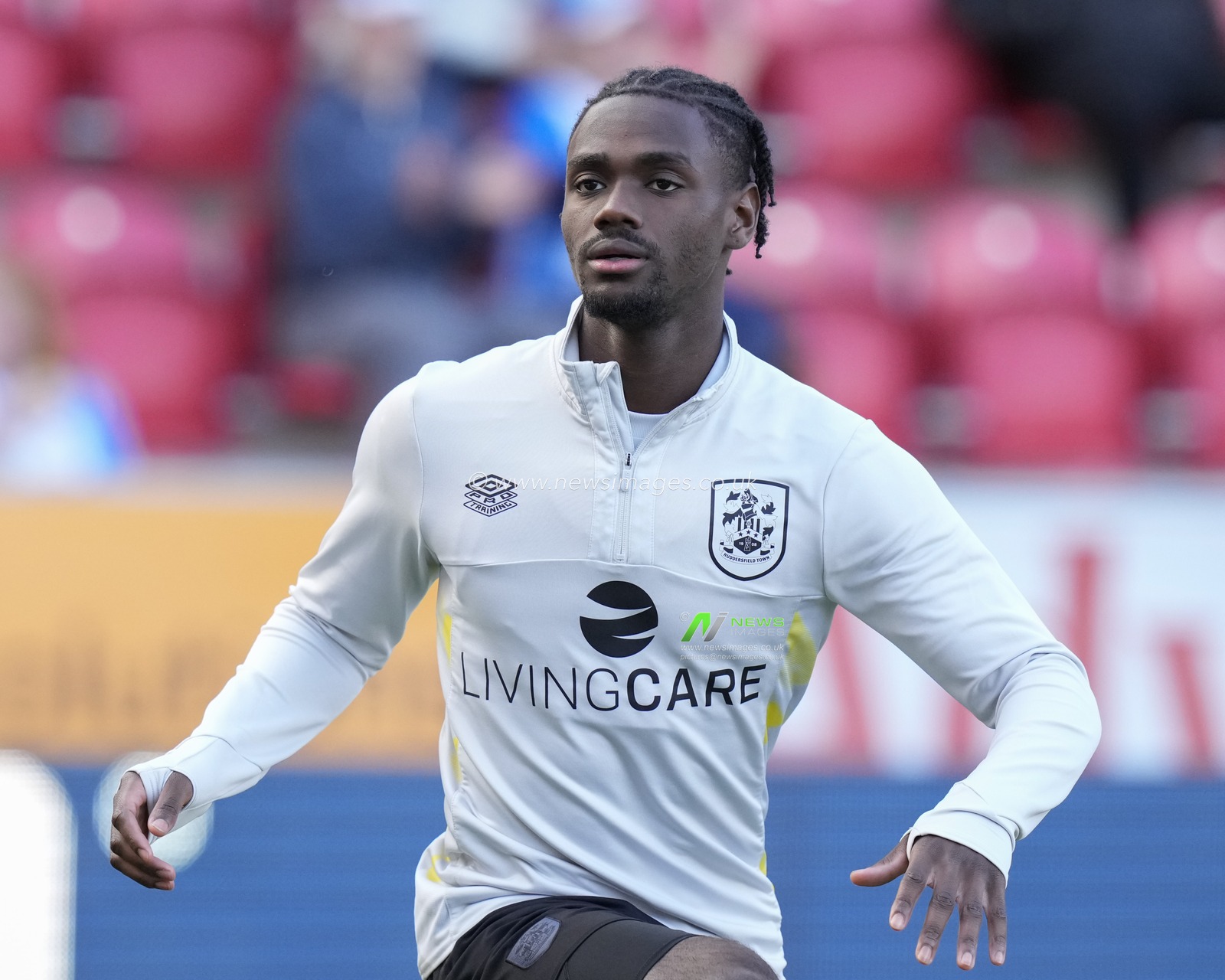 Aaron Rowe #20 of Huddersfield Town warms up before  the Sky Bet Championship match Rotherham United vs Huddersfield Town at AESSEAL New York Stadium, Rotherham, United Kingdom, 15th October 2022

(Photo by Steve Flynn/News Images)
