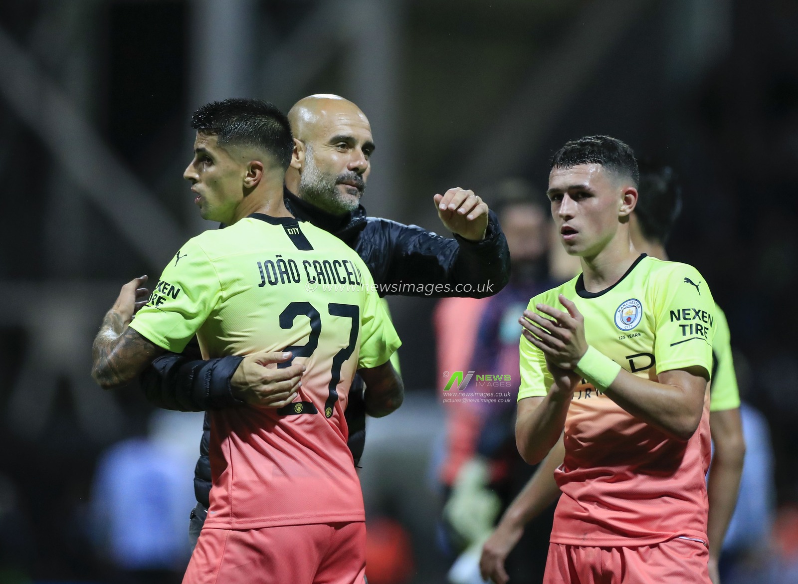 24th September 2019 , Deepdale, Preston, England; EFL Carabao Cup Football, Third Round Preston North End vs Manchester City ;  Manchester City manager Pep Guardiola celebrates victory with Joao Cancelo (27) and Phil Foden (47) 

Credit: Conor Molloy/News Images

English Football League images are subject to DataCo Licence