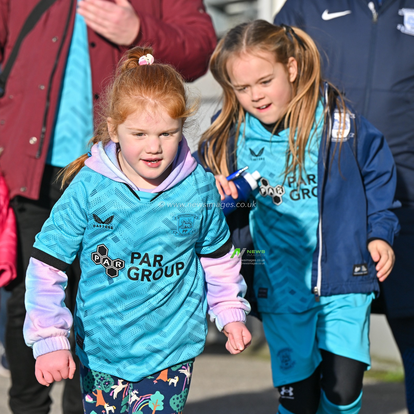 Two young Preston North End fans arrive to Deepdale ahead of the match, during the Sky Bet Championship match Preston North End vs Cardiff City at Deepdale, Preston, United Kingdom, 25th November 2023

(Photo by Cody Froggatt/News Images)