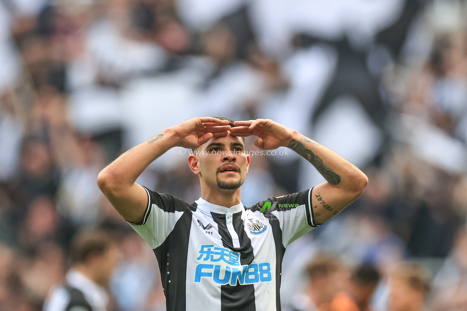 Bruno Guimaraes #39 of Newcastle United and double goal scorer celebrates the 2-1 win over Leicester City with the fans
