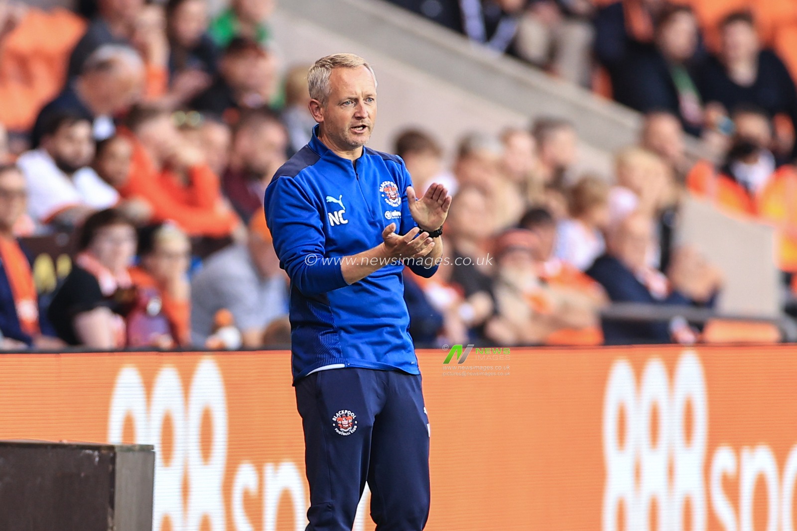 Neil Critchley Head Coach of Blackpool applauds his players