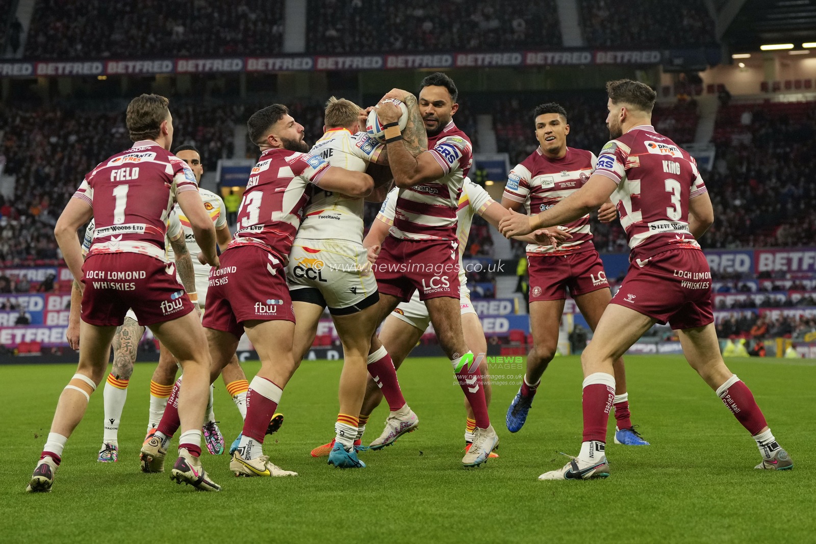 Bevan French #2 of Wigan Warriors  and Tom Johnstone #24 of Catalans Dragons compete for a high ball during the Betfred Super League Grand Final match Wigan Warriors vs Catalans Dragons at Old Trafford, Manchester, United Kingdom, 14th October 2023

(Photo by Steve Flynn/News Images)