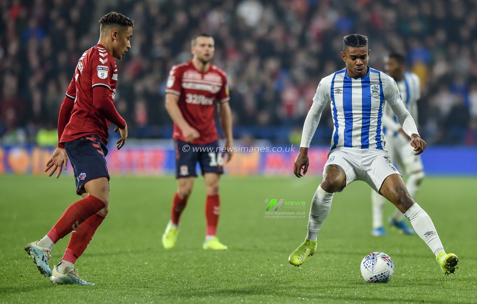 23rd October 2019, John Smith's Stadium, Huddersfield, England; Sky Bet Championship, Huddersfield Town v Middlesbrough : Juninho Bacuna (7) of Huddersfield Town attacks the Middlesborough defence.

Credit: Dean Williams/News Images