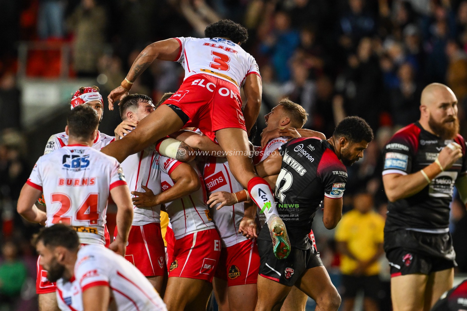 Moses Mbye of St. Helens celebrates his drop goal in extra time to win Betfred Super League Round 21 match St Helens vs Salford Red Devils at Totally Wicked Stadium, St Helens, United Kingdom, 8th August 2024

(Photo by Craig Thomas/News Images)