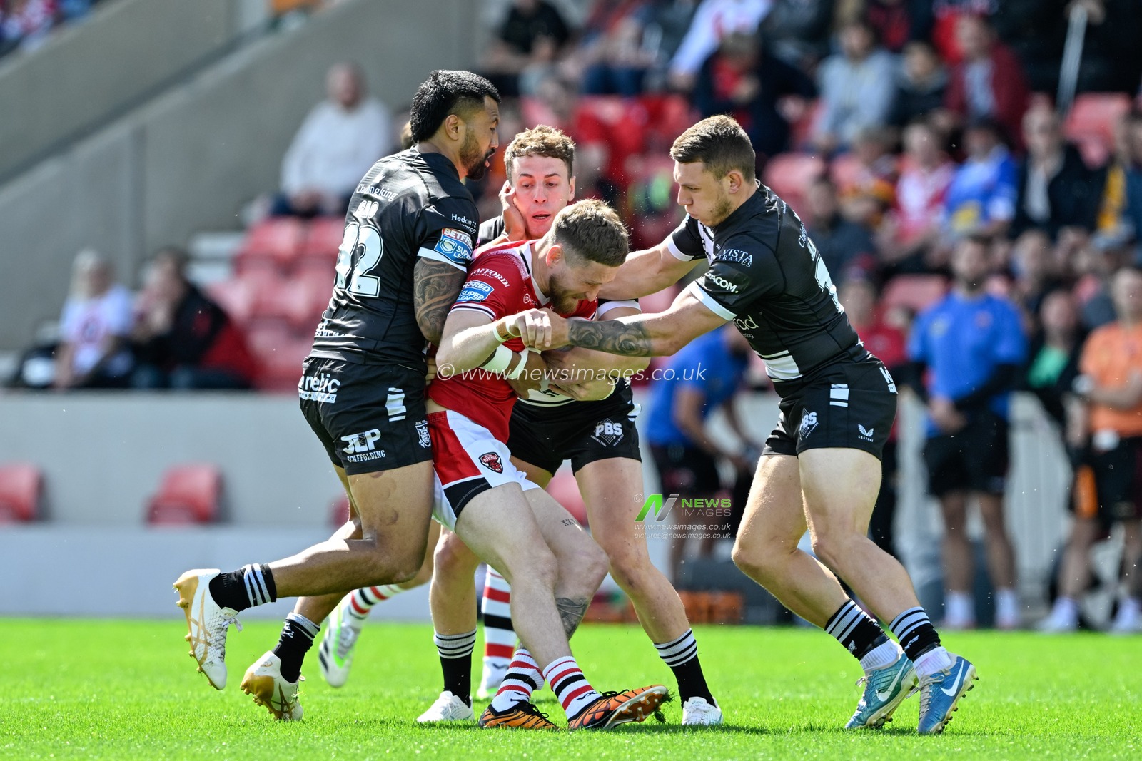 Ethan Ryan of Salford Red Devils gets tackled during the Betfred Super League Round 16 match Salford Red Devils vs Hull FC at Salford Community Stadium, Eccles, United Kingdom, 7th July 2024

(Photo by Cody Froggatt/News Images)