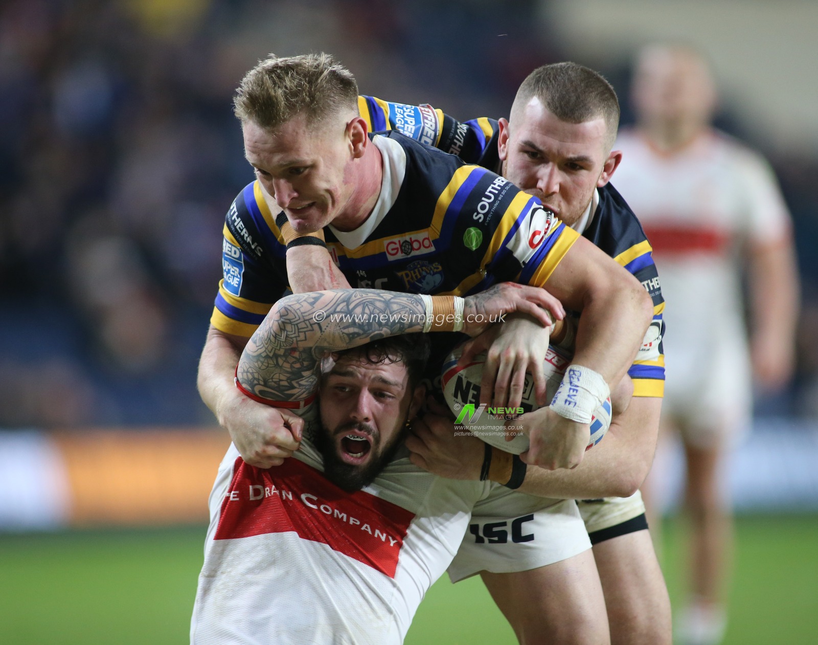 14th February 2020, Headingley Carnegie Stadium, Leeds, England; Betfred Super League, Leeds Rhinos v Hull Kingston Rovers : Will Dagger of Hull KR tackled by Brad Dwyer and Cameron Smith of Leeds Rhinos.