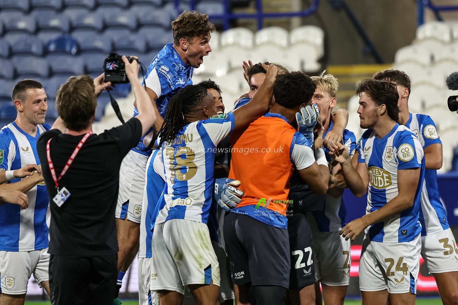 Huddersfield players celebrate with penalty saving hero Lee Nicholls of Huddersfield Town during the Carabao Cup match Huddersfield Town vs Leicester City at Accu Stadium, Huddersfield, United Kingdom, 13th August 2025

(Photo by Mark Cosgrove/News Images)