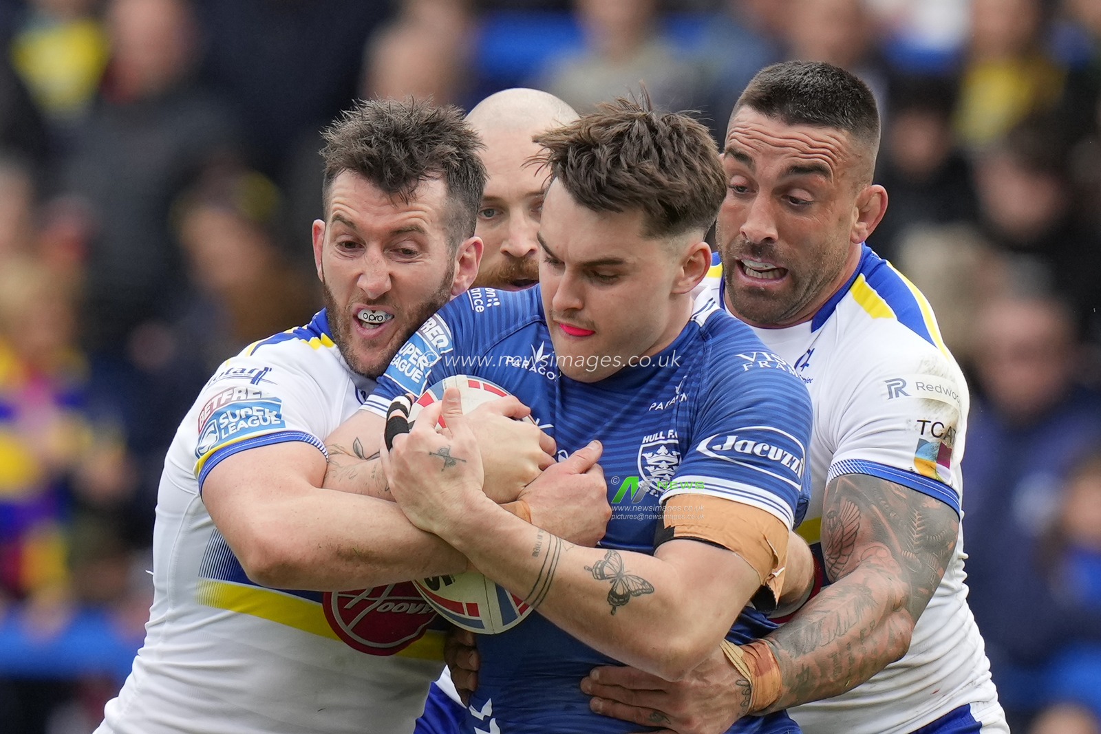 Tex Hoy #1 of Hull FC is held by Stefan Ratchford #4 of Warrington Wolves and Paul Vaughan #10 of Warrington Wolves during the Betfred Super League Round 7 match Warrington Wolves vs Hull FC at Halliwell Jones Stadium, Warrington, United Kingdom, 1st April 2023

(Photo by Steve Flynn/News Images)