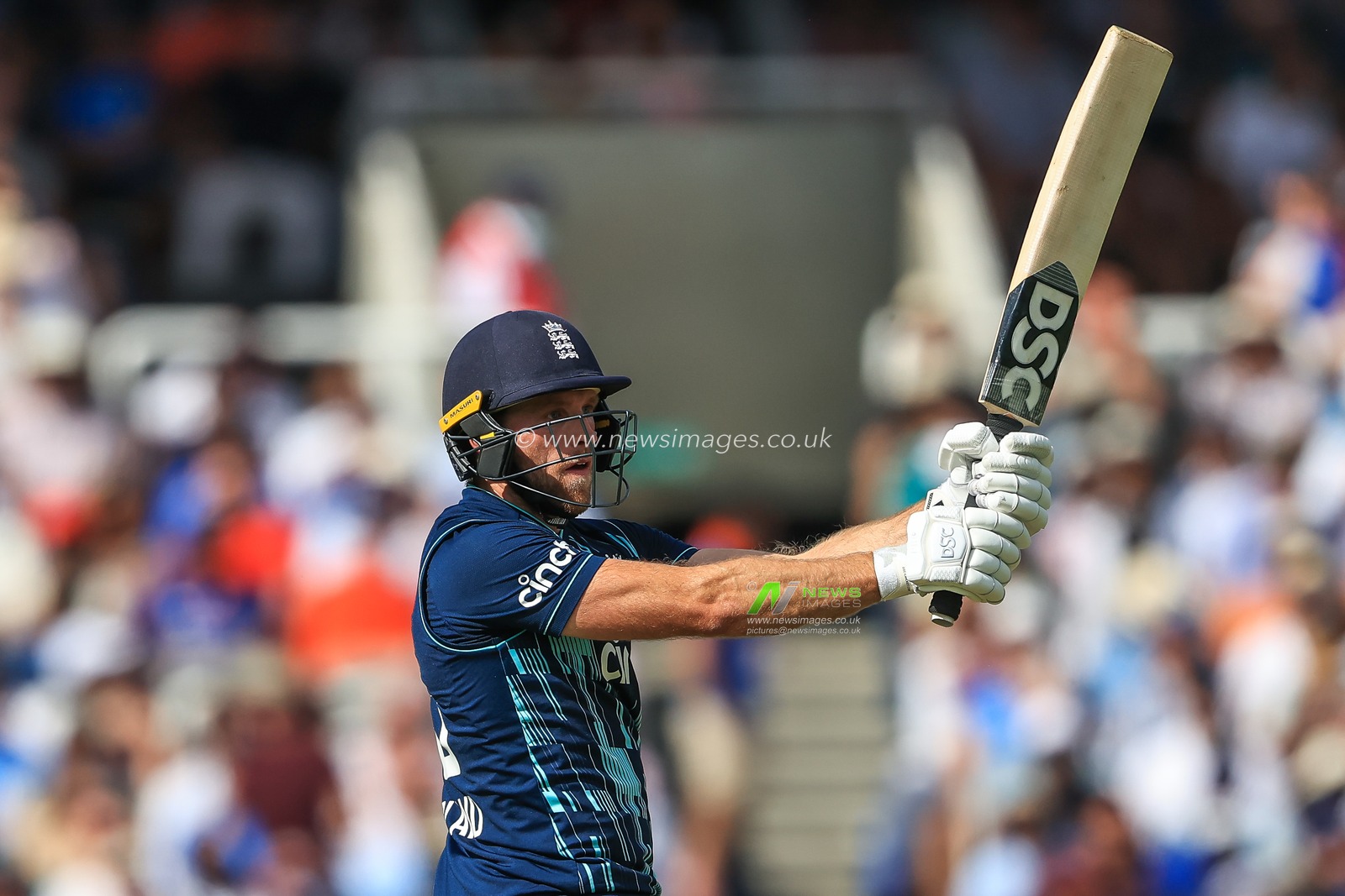 David Willey of England watches his strike go for a six (6)