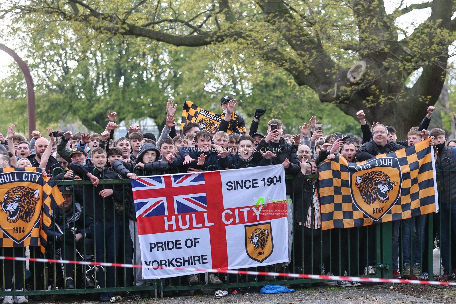 A large crowd of Hull City fans congregate outside the KCOM Stadium Waiting for the Hull City players