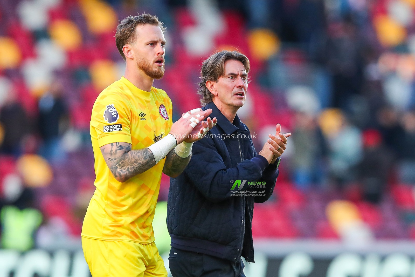 Mark Flekken and Thomas Frank of Brentford acknowledge the fans after the teams draw following the Premier League match Brentford vs West Ham United at The Gtech Community Stadium, London, United Kingdom, 28th September 2024

(Photo by Izzy Poles/News Images)