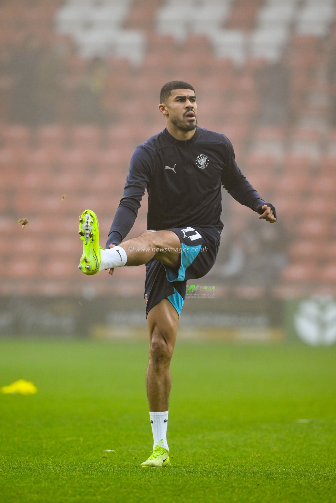 Ashley Fletcher of Blackpool stretches during the pre-game warmup ahead of the Sky Bet League 1 match Wrexham vs Blackpool at SToK Cae Ras, Wrexham, United Kingdom, 26th December 2024

(Photo by Craig Thomas/News Images)