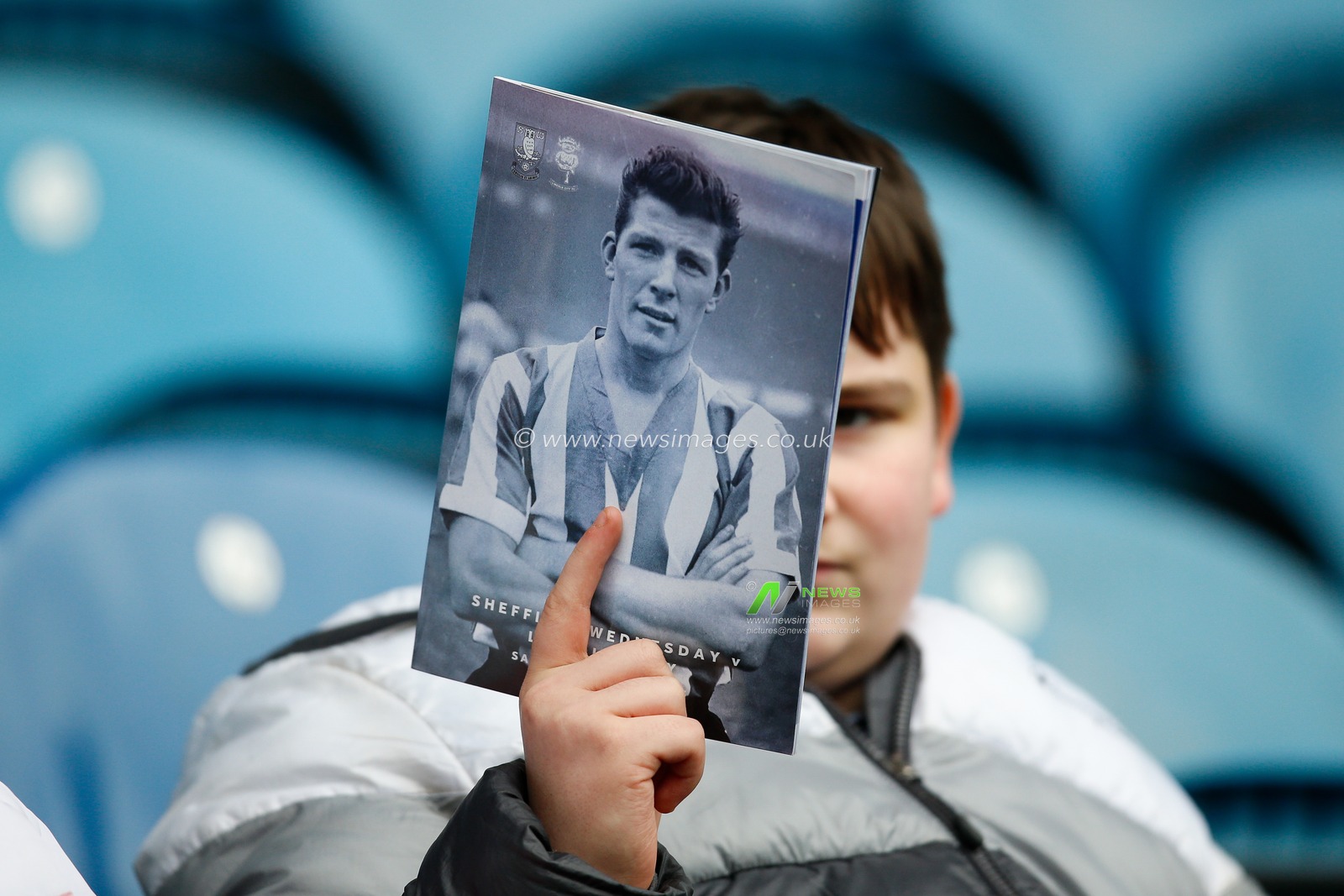 A fan holds up the match day programme during the Sky Bet League 1 match Sheffield Wednesday vs Lincoln City at Hillsborough, Sheffield, United Kingdom, 1st April 2023

(Photo by Ben Early/News Images)