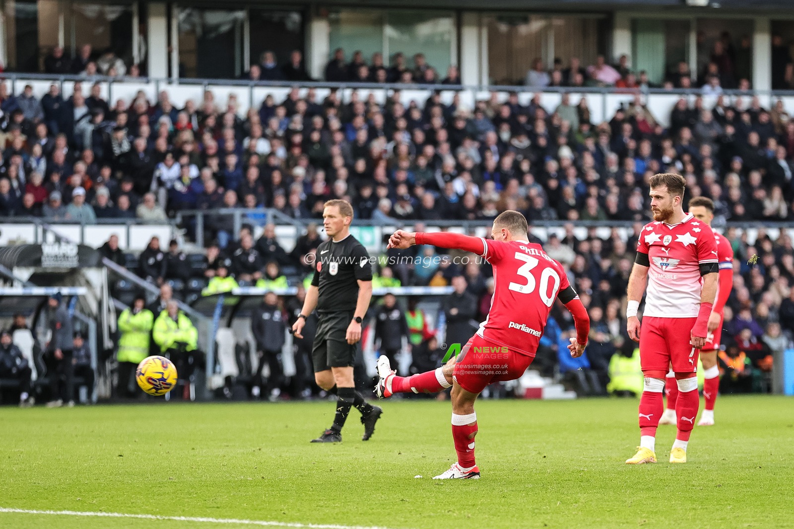 Adam Phillips #30 of Barnsley takes a free kick causing Joe Wildsmith #1 of Derby County to make a save during the Sky Bet League 1 match Derby County vs Barnsley at Pride Park Stadium, Derby, United Kingdom, 11th November 2023

(Photo by Mark Cosgrove/News Images)