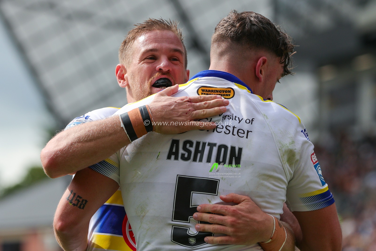 Matty Ashton #5 of Warrington Wolves celebrates his try with Matt Dufty and makes the score 6-8 in the first half of the Betfred Super League Round 22 match Leeds Rhinos vs Warrington Wolves at Headingley Stadium, Leeds, United Kingdom, 20th August 2023

(Photo by James Heaton/News Images)