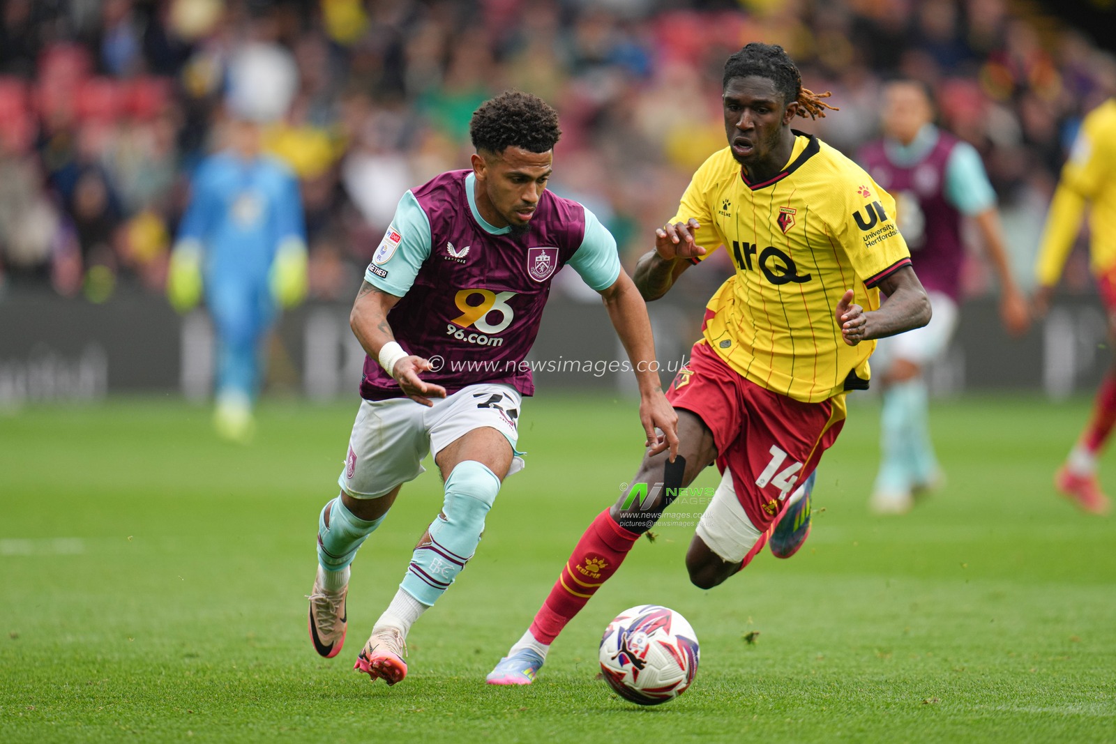 Marcus Edwards of Burnley drives forward with the ball under pressure from Pierre Dwomoh of Watford during the Sky Bet Championship match Watford vs Burnley at Vicarage Road, Watford, United Kingdom, 18th April 2025

(Photo by Harvey Murphy/News Images)