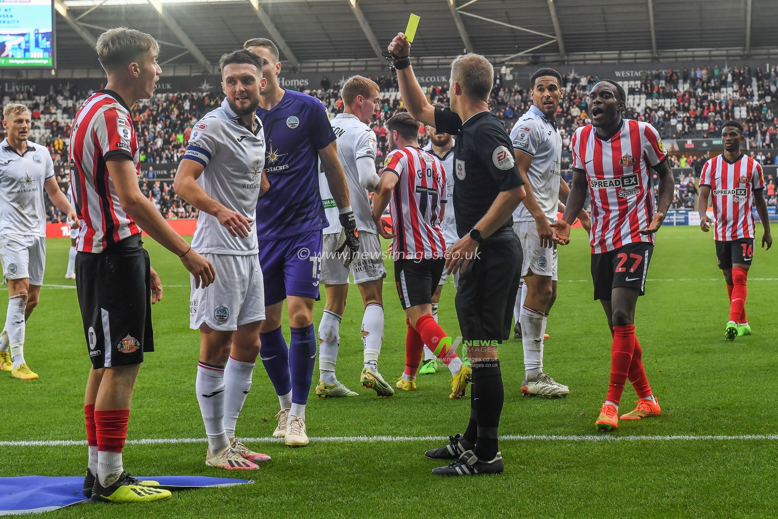 Jack Clarke #20 of Sunderland receives a yellow card from referee Gavin Ward during the Sky Bet Championship match Swansea City vs Sunderland at Swansea.com Stadium, Swansea, United Kingdom, 8th October 2022

(Photo by Mike Jones/News Images)