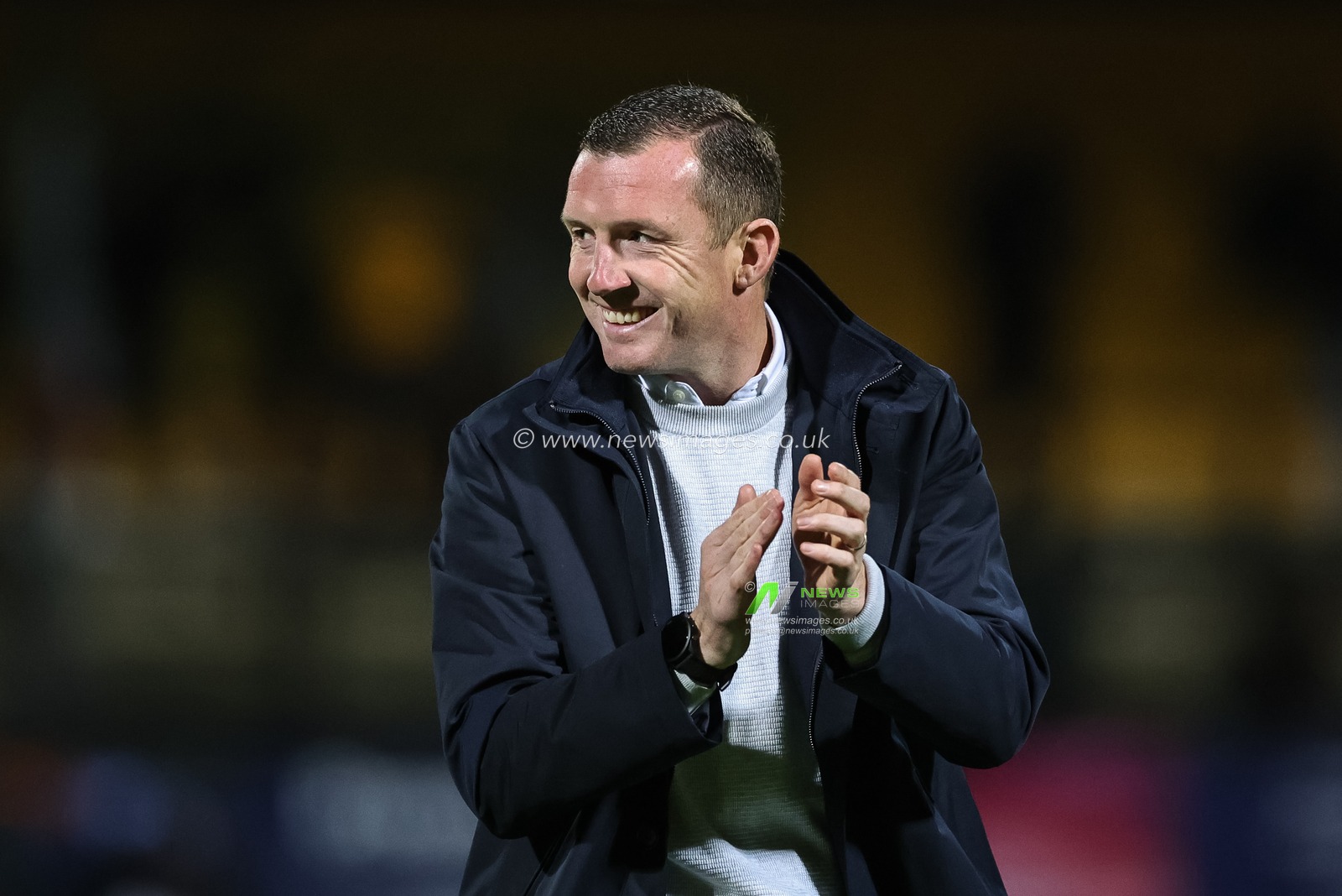 Neill Collins Head coach of Barnsley applauds the traveling fans during the Sky Bet League 1 match Cambridge United vs Barnsley at Abbey Stadium, Cambridge, United Kingdom, 3rd October 2023

(Photo by Mark Cosgrove/News Images)