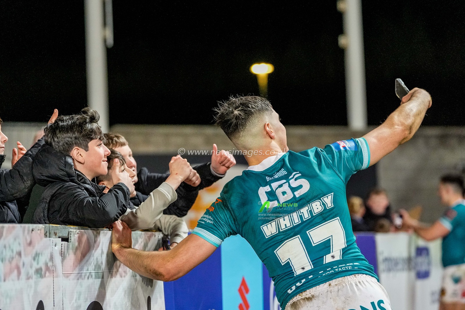 George Whitby of St Helens takes selfies with fans at full time during the Betfred Challenge Cup Quarter Final match St Helens vs Catalans Dragons at The BrewDog Stadium, St Helens, United Kingdom on 10 April 2026

(Photo by Maynard Manyowa/News Images)