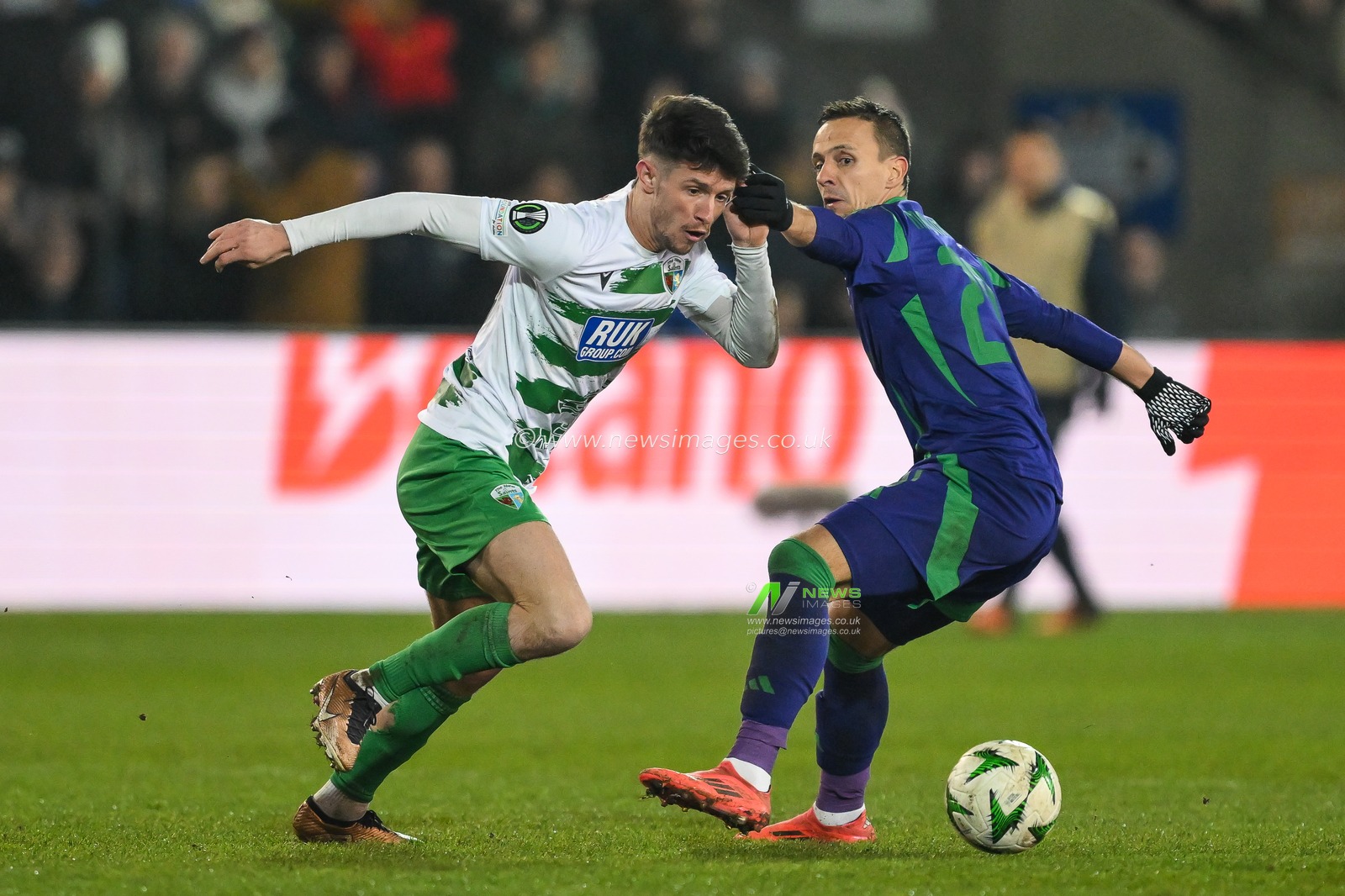 Rory Holden of The New Saints F.C. breaks past Vitor Hugo of Panathinaikos during the UEFA Conference League - League Stage The New Saints v Panathinaikos at Croud Meadow, Shrewsbury, United Kingdom, 12th December 2024

(Photo by Craig Thomas/News Images)