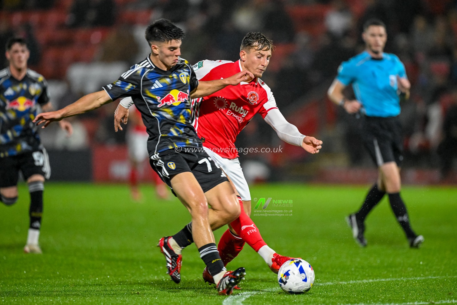 Will Firth of Leeds United  tackles Will Davies of Fleetwood Town during the The Vertu Trophy match Fleetwood Town vs Leeds United Academy at Highbury Stadium, Fleetwood, United Kingdom, 7th October 2025

(Photo by Adam Gee/News Images)