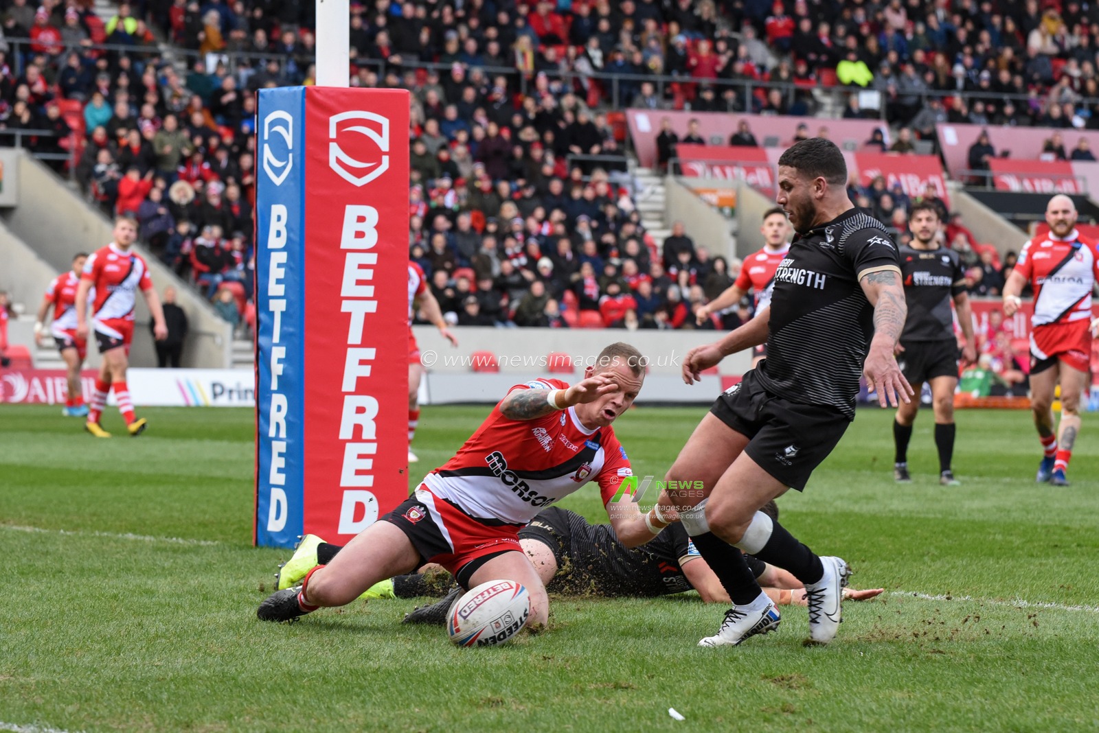 8th February 2020, AJ Bell Stadium, Eccles, England; Betfred Super League, Salford Red Devils v Toronto Wolfpack : Kevin Brown (31) of Salford Red Devils goes over for a try