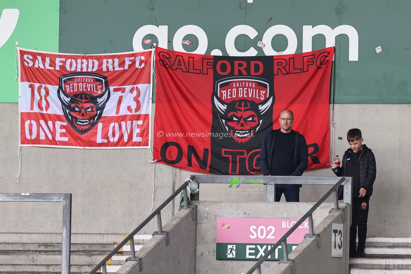 Salford fans arrive and set up their flags during the Betfred Super League Round 12 match Salford Red Devils vs Wigan Warriors at Salford Community Stadium, Eccles, United Kingdom, 26th May 2024

(Photo by Mark Cosgrove/News Images)