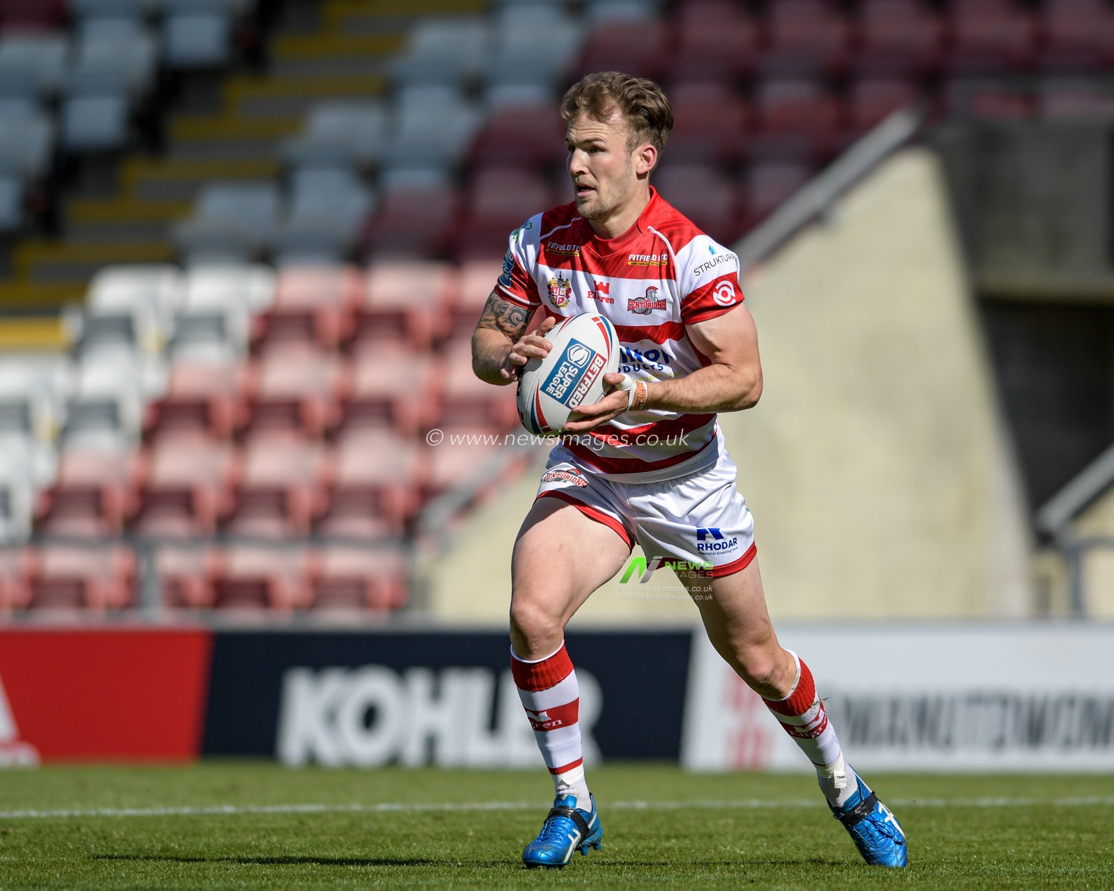 Ben Reynolds (30) of Leigh Centurions runs with the ball