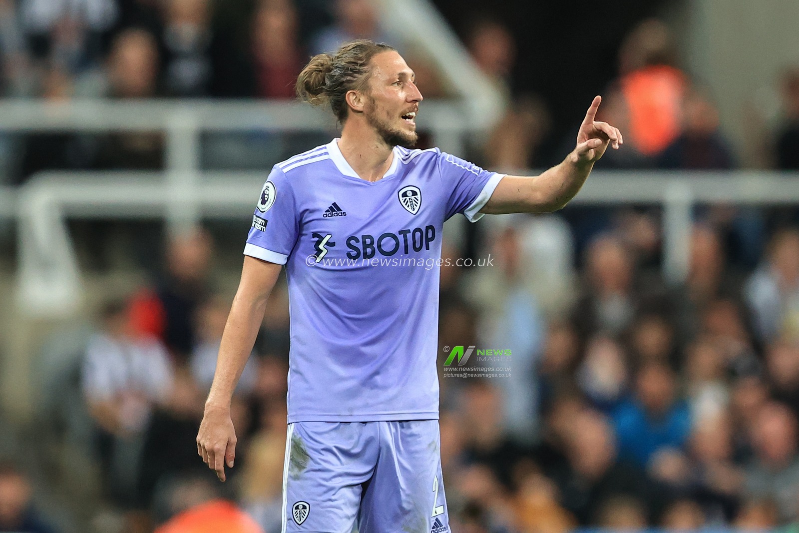 Luke Ayling #2 of Leeds United gives his team instructions