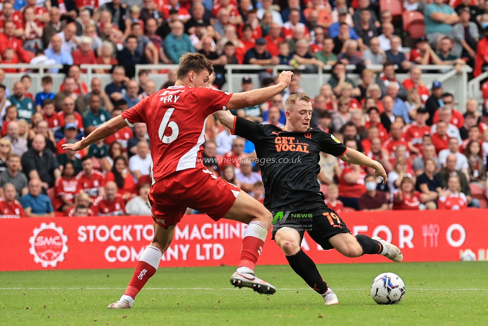Shayne Lavery #19 of Blackpool shoots on goal