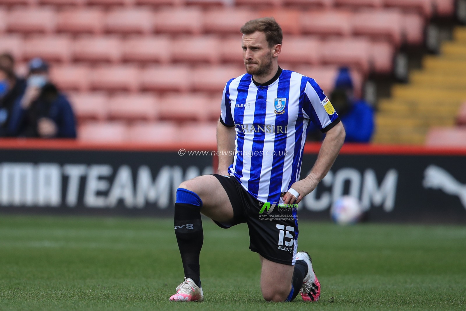 Tom Lees #15 of Sheffield Wednesday takes the knee