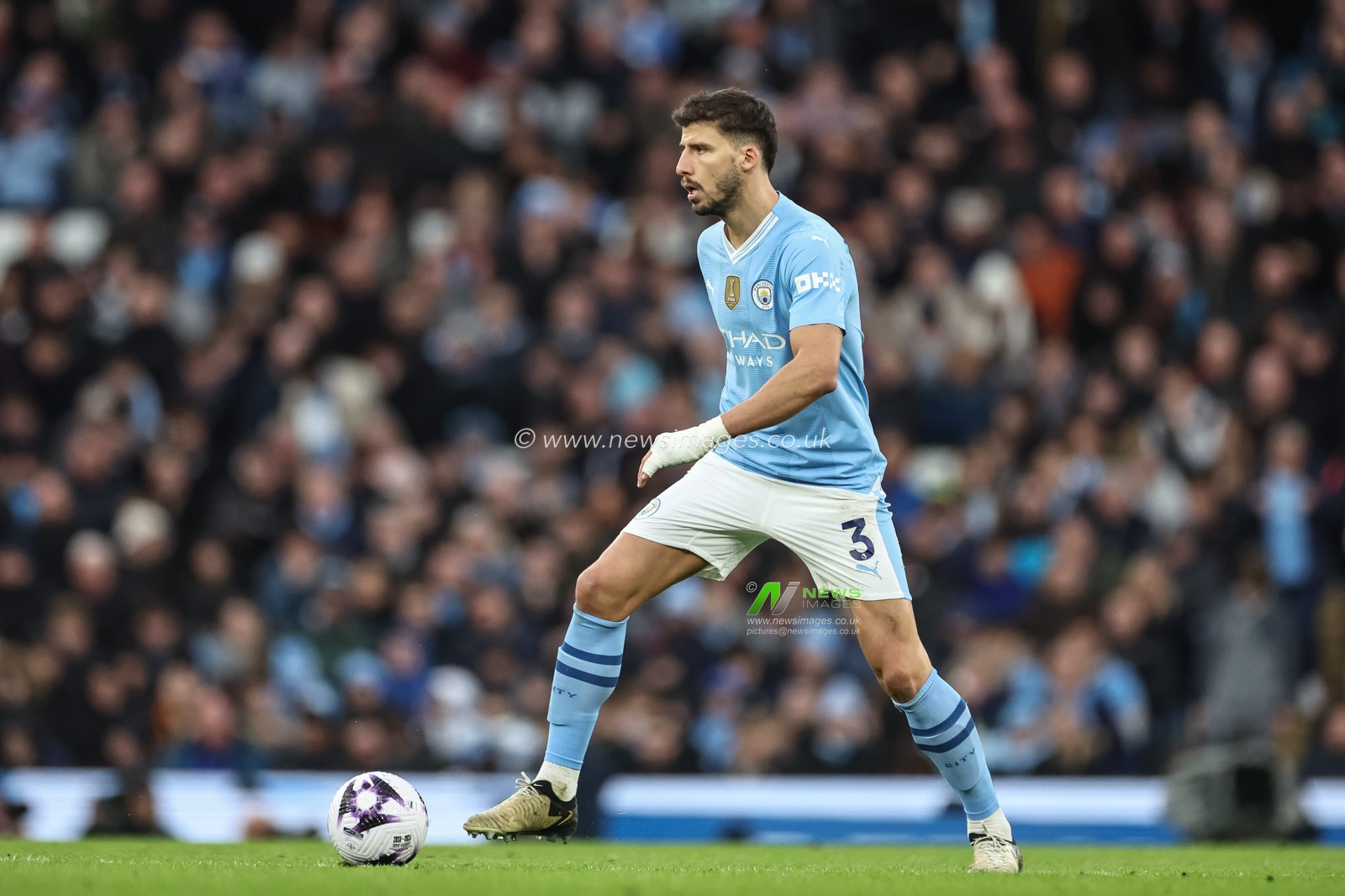 RÃºben Dias of Manchester City with the ball during the Premier League match Manchester City vs Manchester United at Etihad Stadium, Manchester, United Kingdom, 3rd March 2024

(Photo by Mark Cosgrove/News Images)