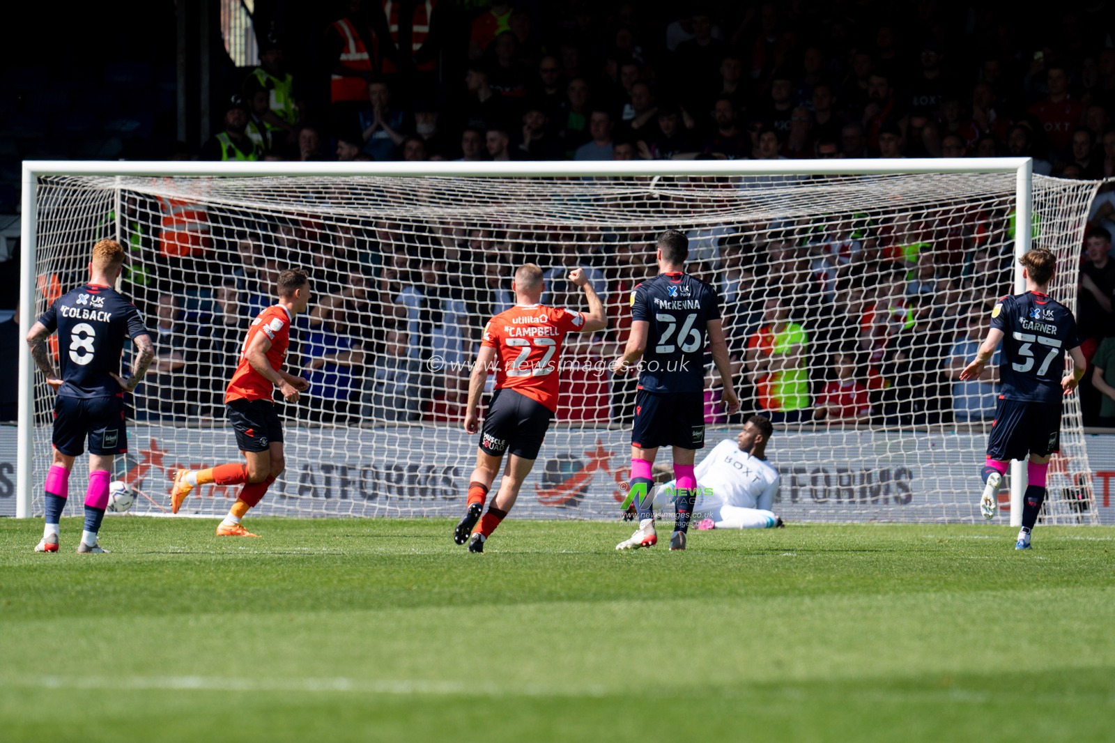 Kal Naismith #4 of Luton Town scores form the penalty spot