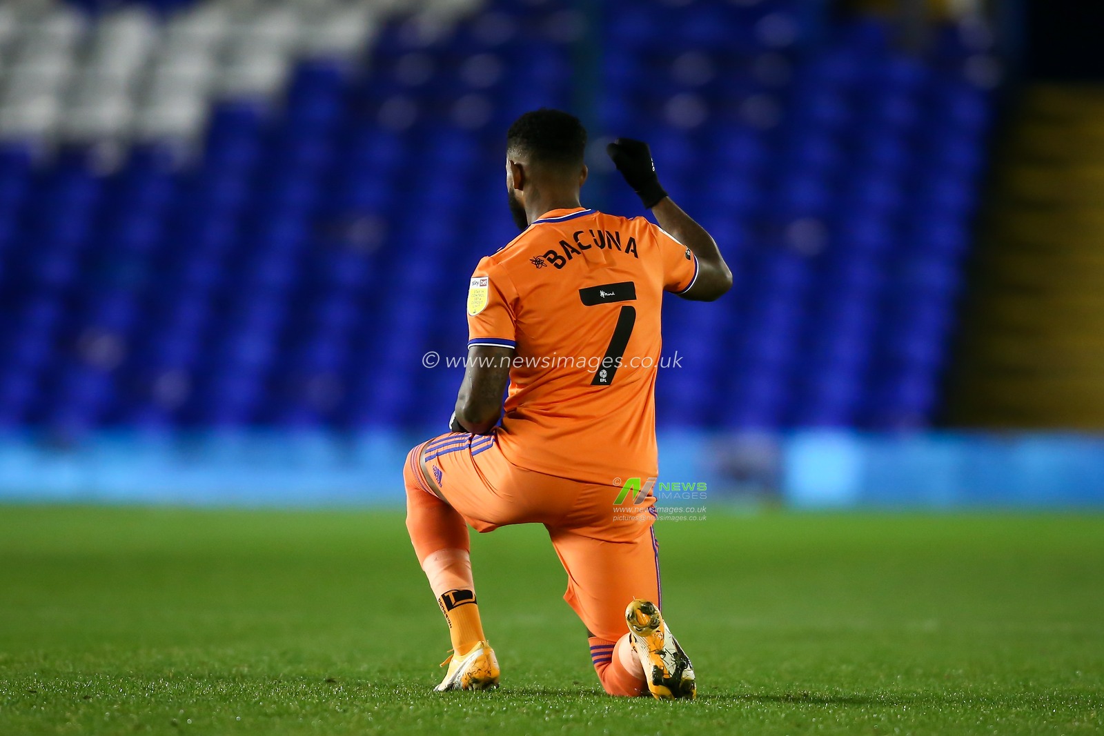 Leandro Bacuna #7 of Cardiff City takes a knee to show his support of the BLM