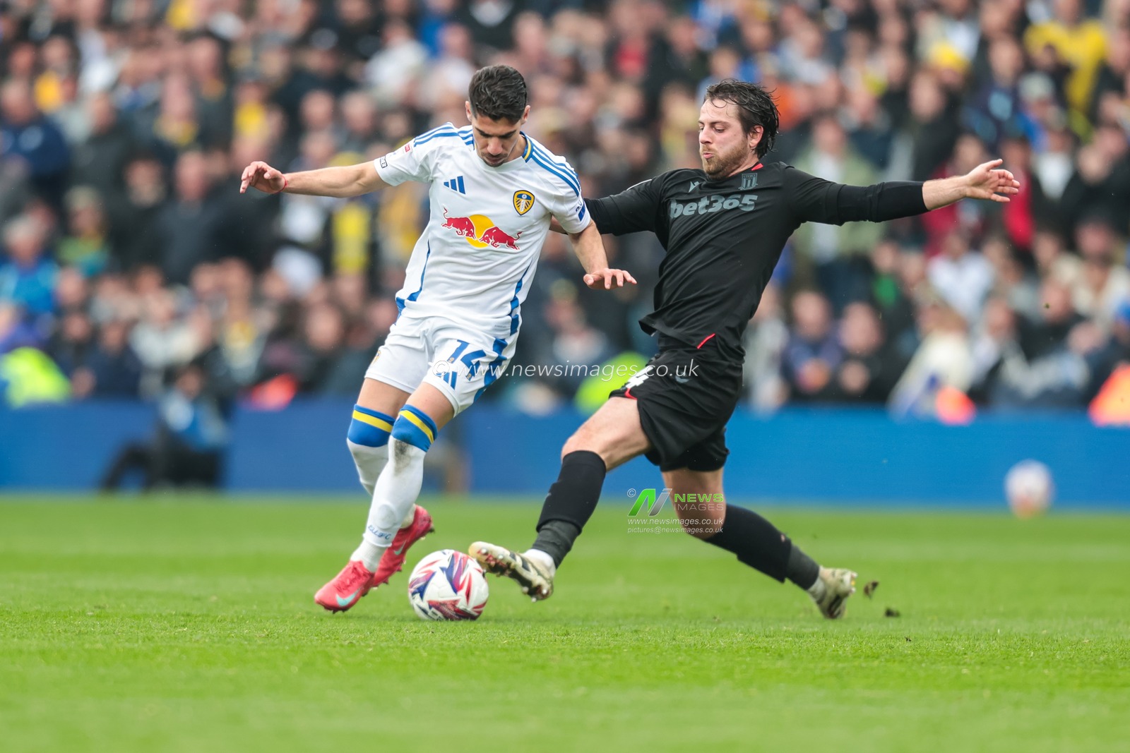 Manor Solomon of Leeds United is tackled by Ben Pearson of Stoke City during the Sky Bet Championship match Leeds United vs Stoke City at Elland Road, Leeds, United Kingdom, 21st April 2025

(Photo by Richard Bierton/News Images)