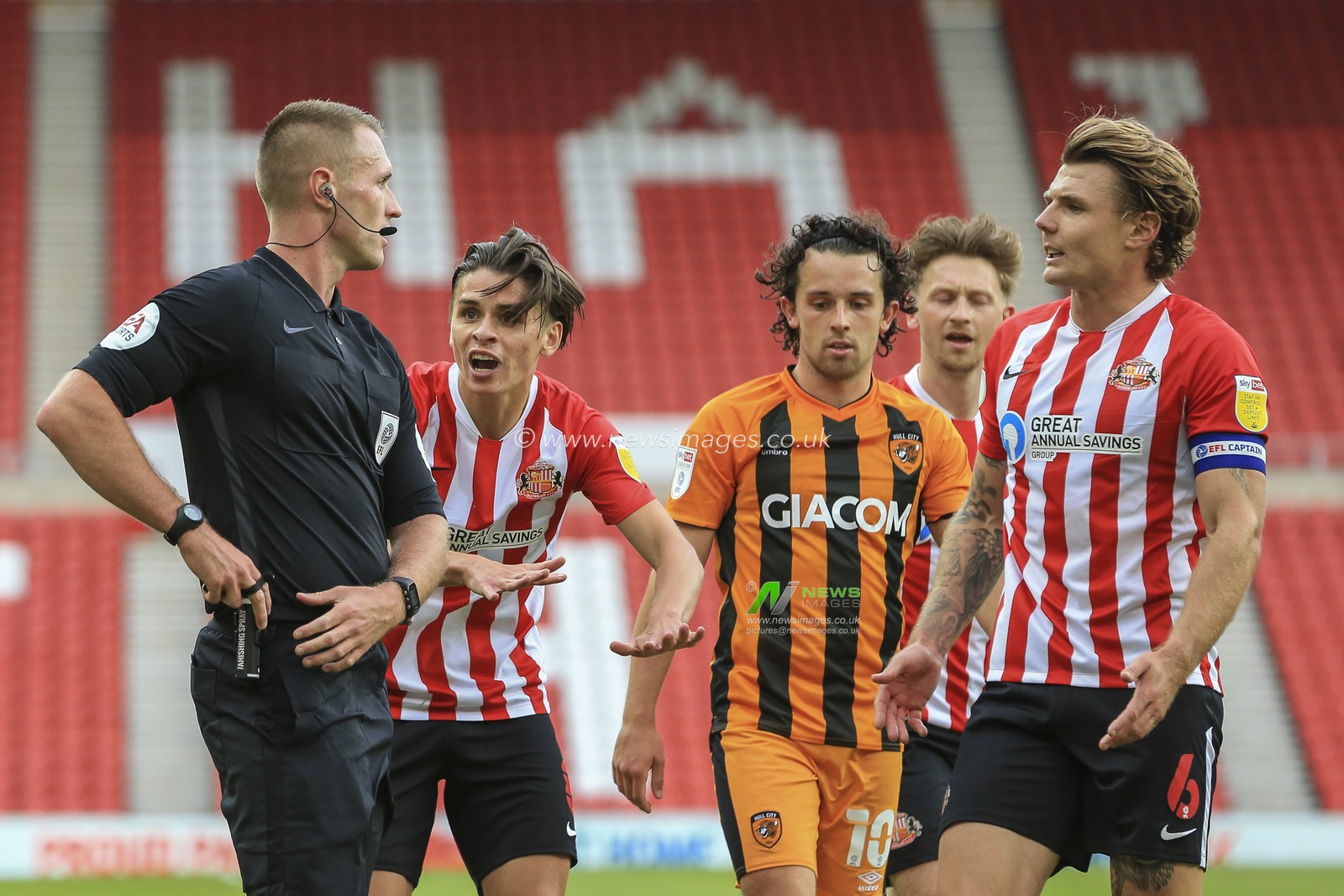 George Dobson (8) of Sunderland and Max Power (6) of Sunderland in conversation with referee Thomas Bramall