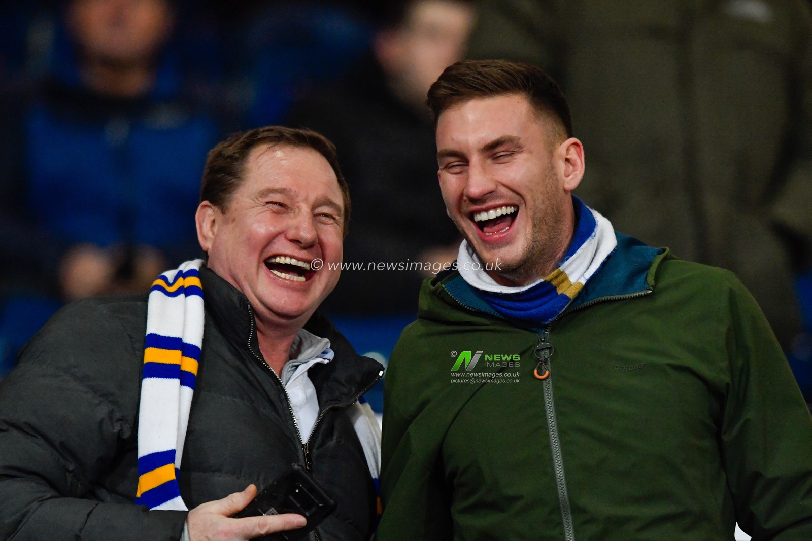 1st January 2020, The Hawthorns, West Bromwich, England; Sky Bet Championship, West Bromwich Albion v Leeds United : Two Leeds United fans share a joke before the game

Credit: Simon Whitehead/News Images