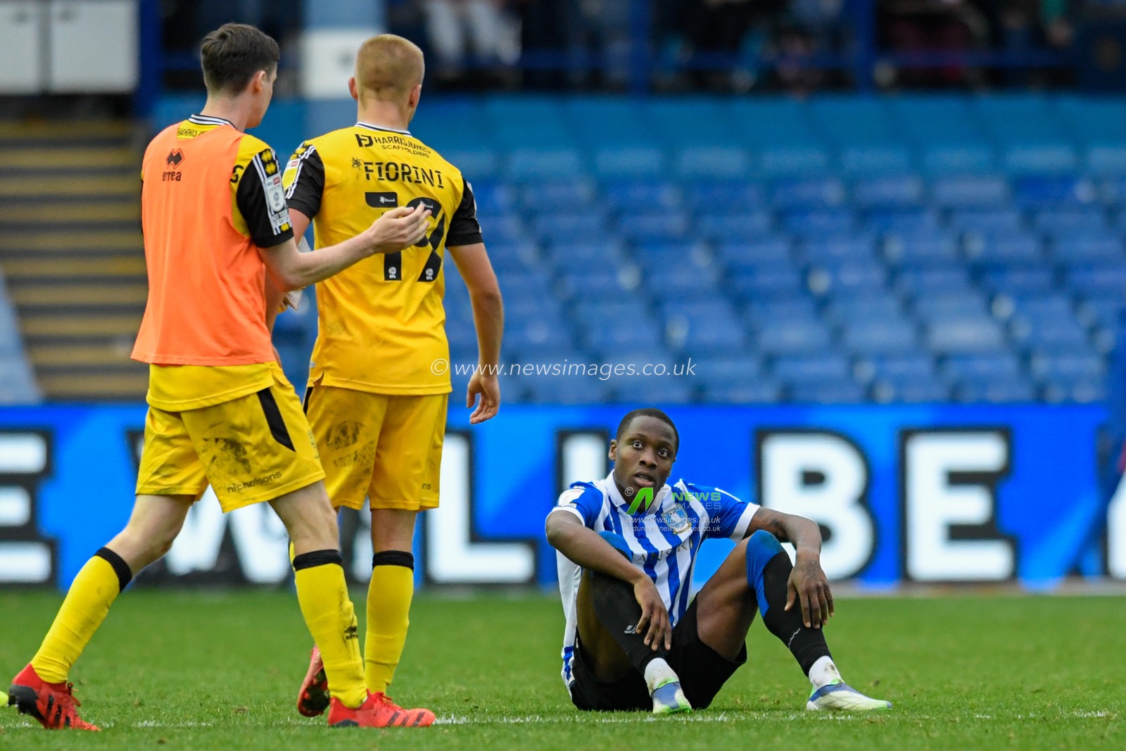 Dennis Adeniran #8 of Sheffield Wednesday sits on the ground at the end of the game after his side drew 1-1 with Lincoln City