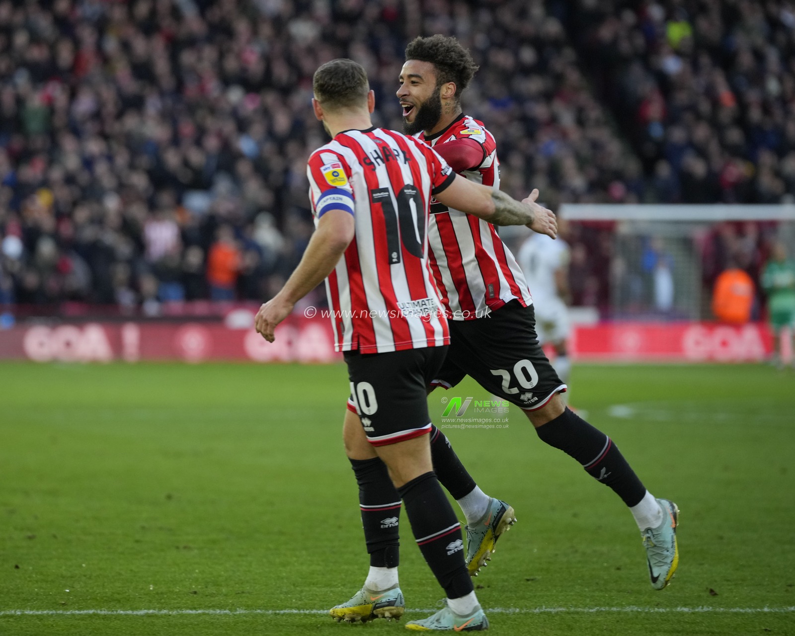 Billy Sharp #10 of Sheffield United celebrates with goalscorer Jayden Bogle after he scored to go 2-0 up during the Sky Bet Championship match Sheffield United vs Stoke City at Bramall Lane, Sheffield, United Kingdom, 14th January 2023

(Photo by Steve Flynn/News Images)